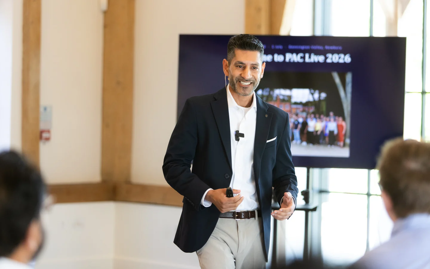 Reza Hooda speaking to a room of accountants at PAC Live 2026, in front of a screen showing the event title.